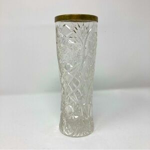 Glass vase with brass top.